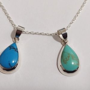 STERLING SILVER AND TURQUOISE PENDANT NECKLACE.